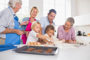 Family preparing biscuits together in the kitchen